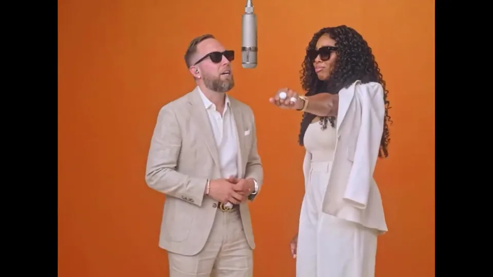 Suited Up: two performers in the orange studio